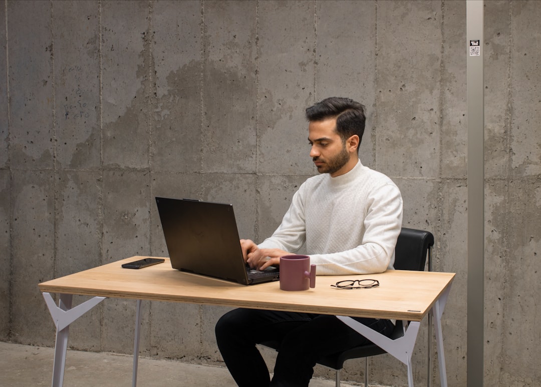A developer monitoring a browser automation workflow on a laptop
