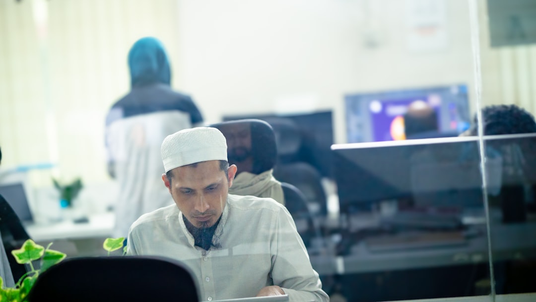 A developer reviewing software code in a clean team workspace