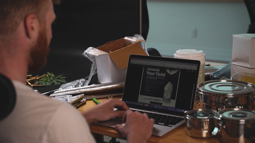 A developer reviewing coding tasks at a calm laptop workspace