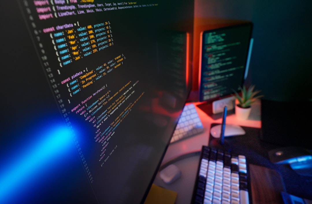A developer planning automation tasks beside a laptop with a small workspace notebook