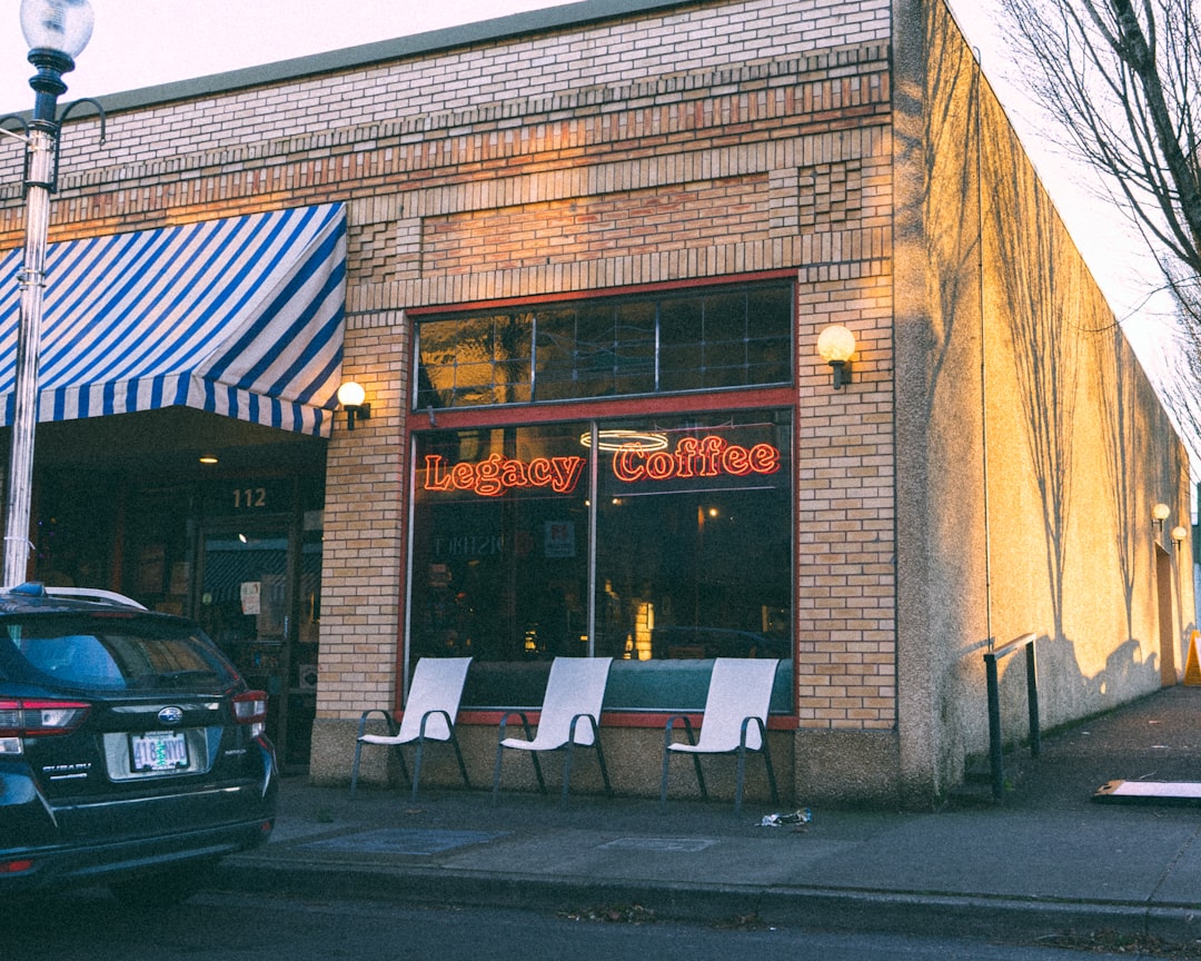 Small business owner reviewing storefront and product photos before improving them for the web