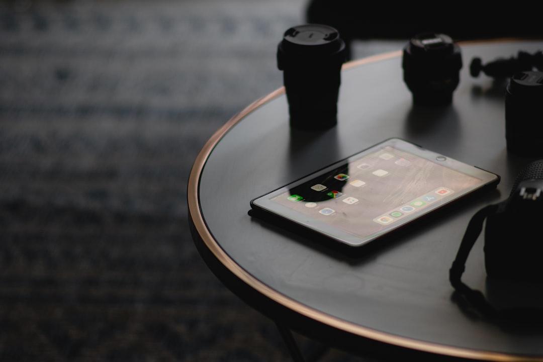 Small business marketing workspace with product photos prepared for an email campaign