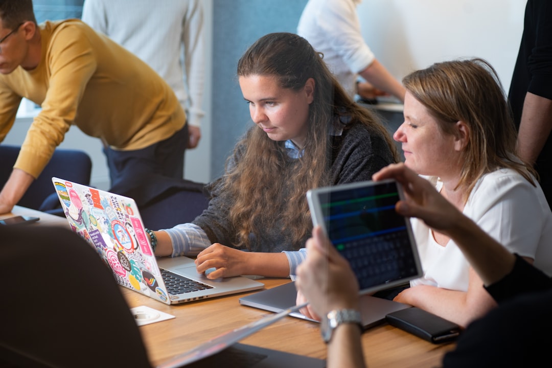 Developers discussing AI workflow design at a bright office desk