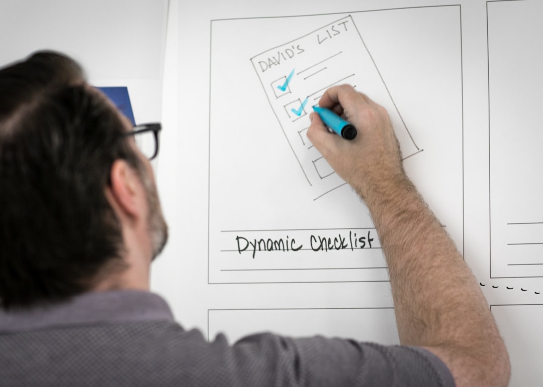 A developer reviewing a conversational website search interface on a laptop