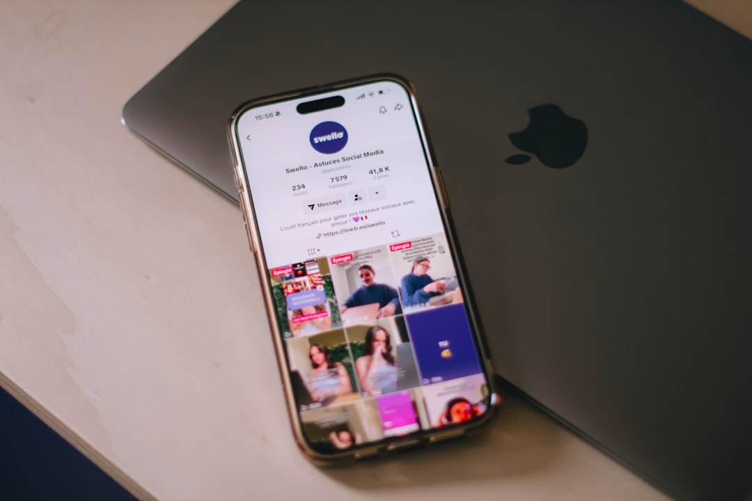 Team member checking social thumbnail readability on phone and desktop after upscaling