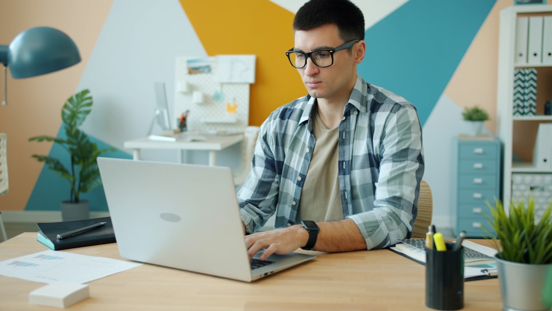 A developer planning an AI automation workflow on a clean laptop workspace
