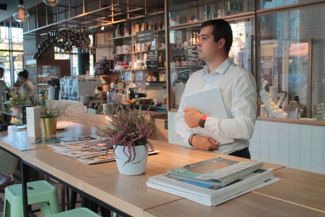 Small business image preparation scene with printed materials and product packaging arranged for clearer online photos