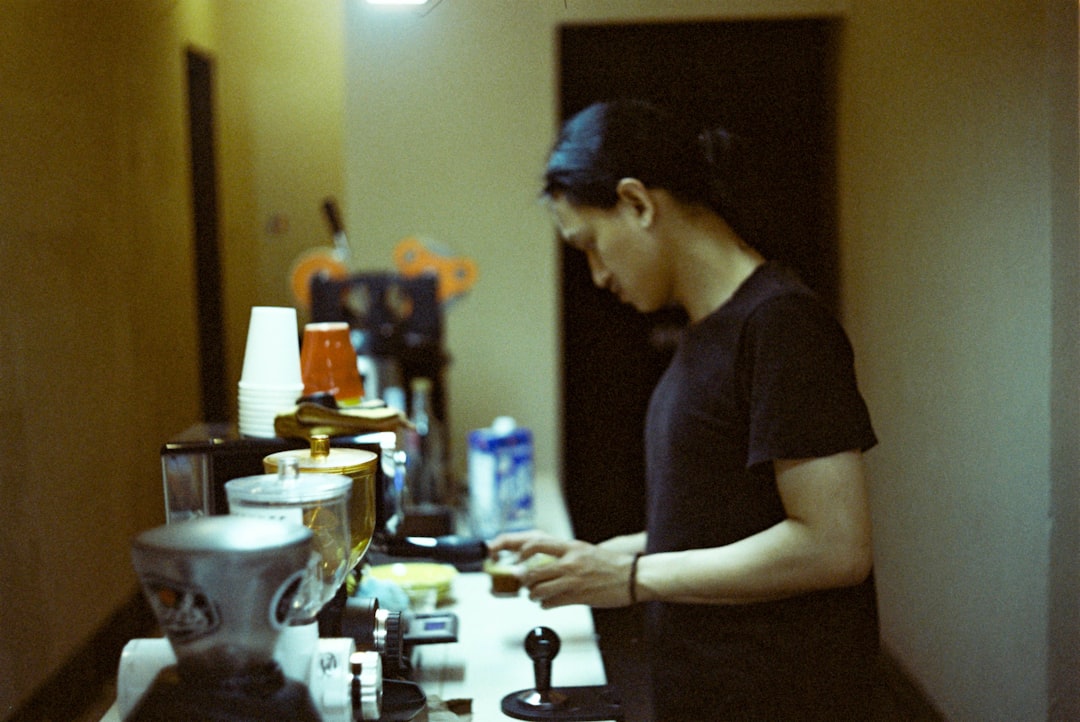 Restaurant owner reviewing menu and food photos before publishing online