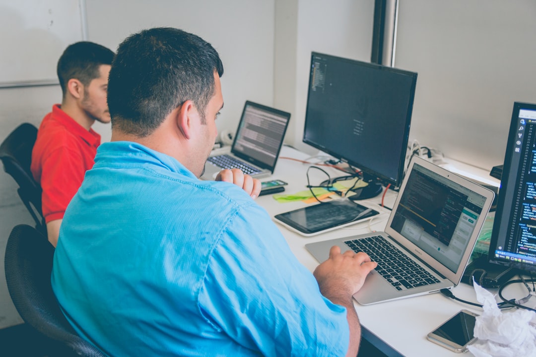 Engineers planning a model serving rollout at a modern office workstation