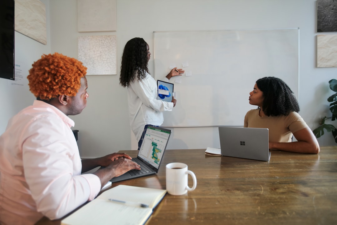 Small game team reviewing tasks while using an AI assistant workflow