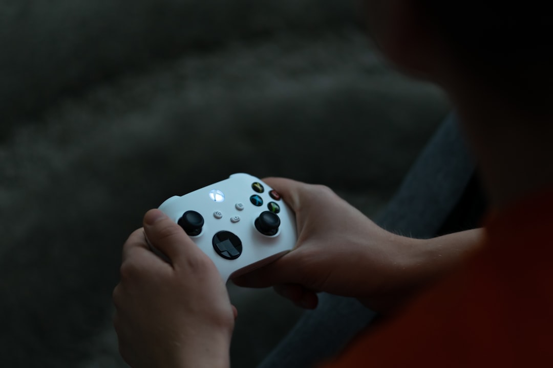 A realistic studio photo of an Xbox Series X25 themed console and matching controller on a gaming desk