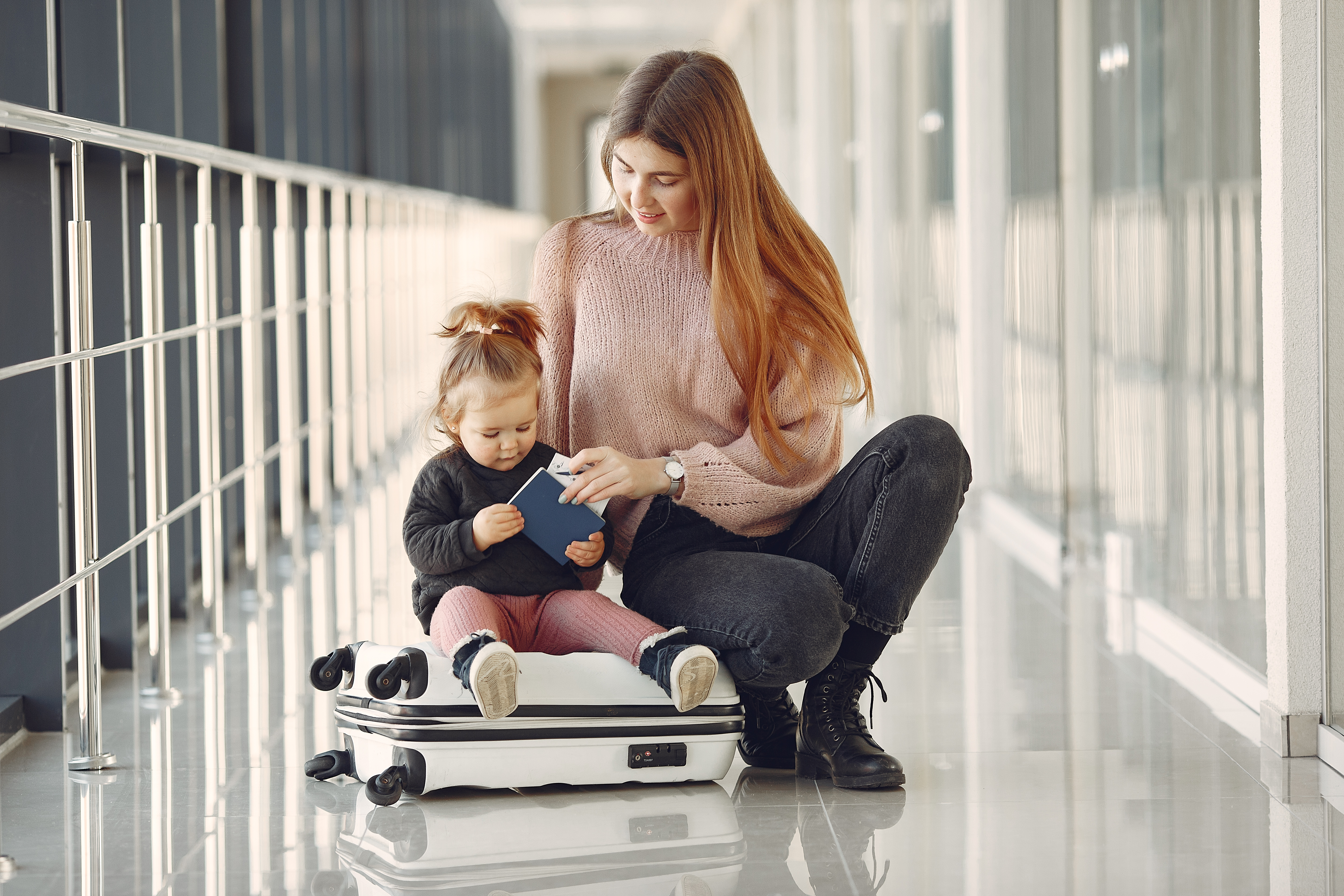 Baby Trend Passport travel system setup beside a car trunk for family errands