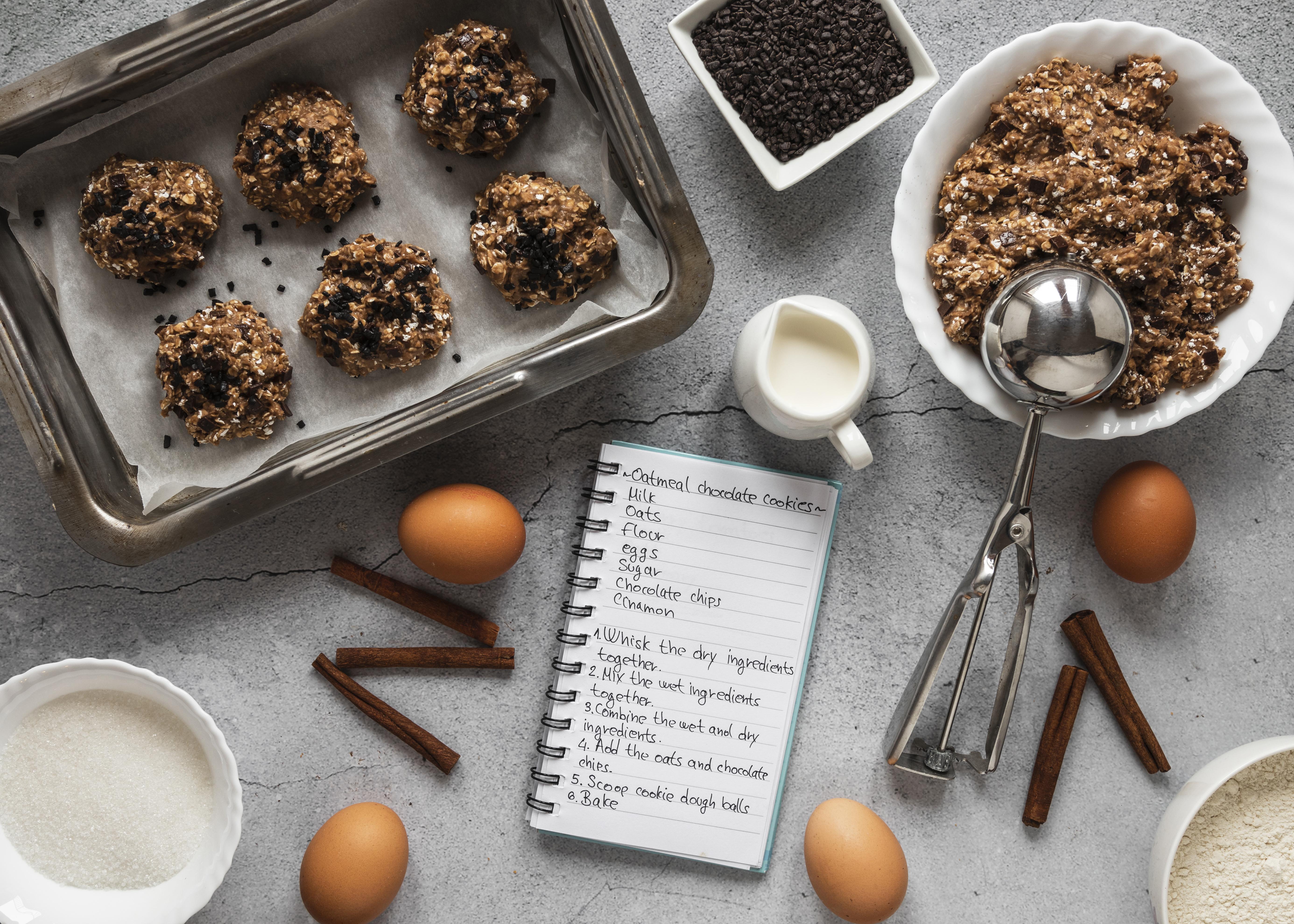 Etekcity Food Kitchen Scale on a kitchen counter with oats and coffee beans beside small containers
