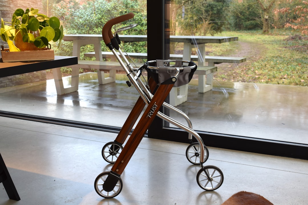 Folding double-decker utility wagon packed with summer outdoor gear on a sunny patio.
