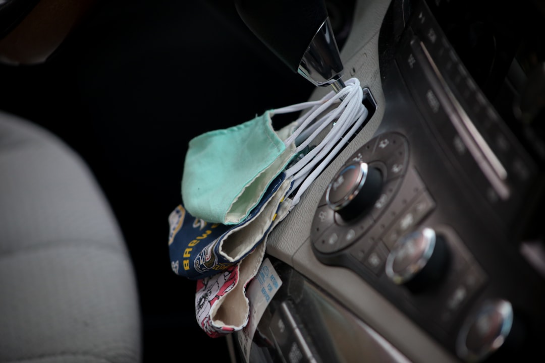 Clip-on cooling fan positioned in a sunlit travel setup for focused summer airflow