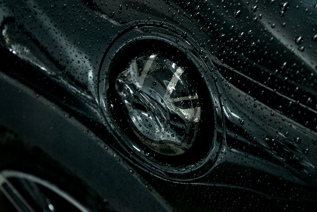 Cloudy car headlights with cleaning cloths and a small restoration bottle for a product-care guide.
