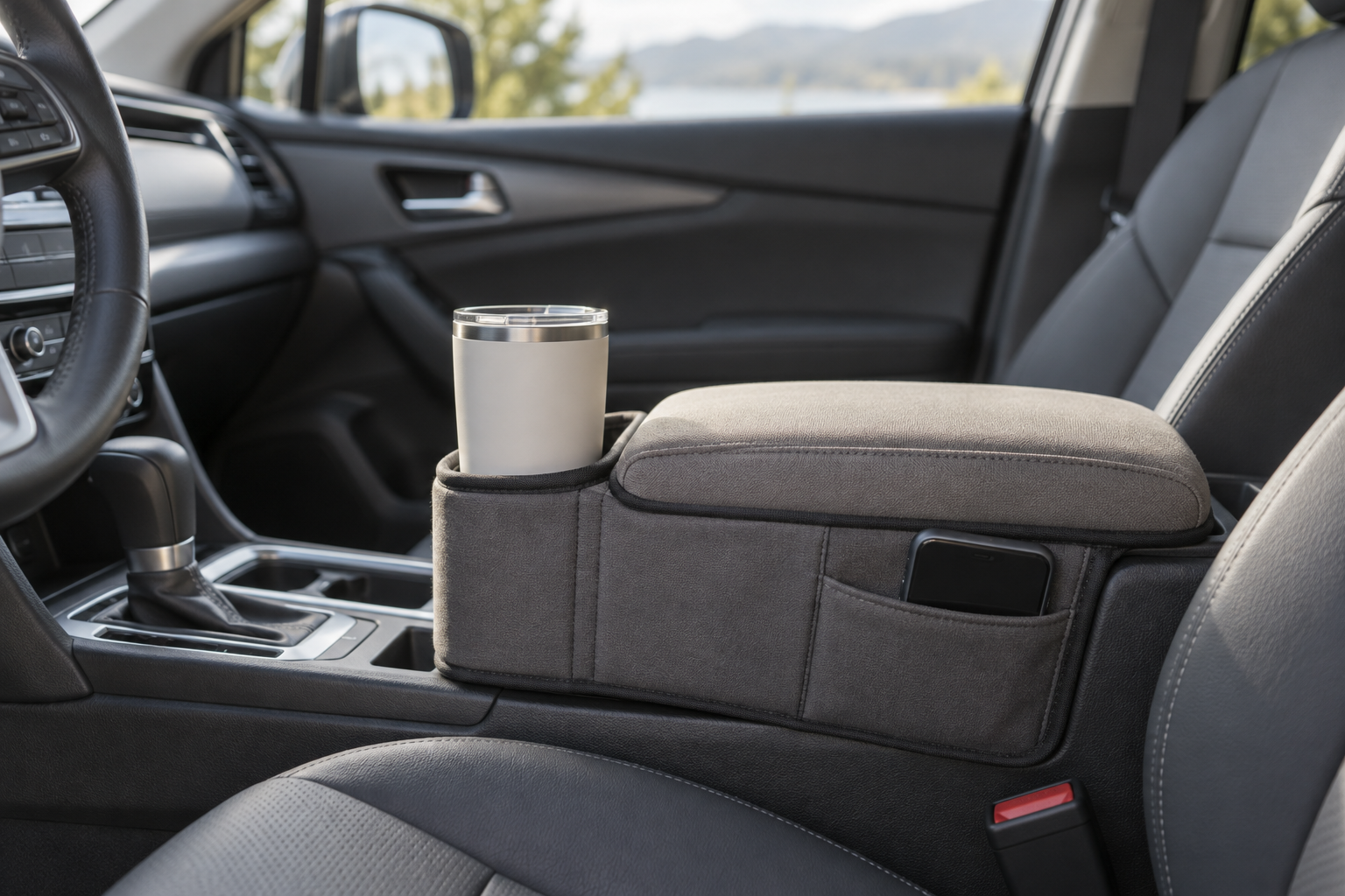 Padded armrest organizer with a phone and drink holder in a car console