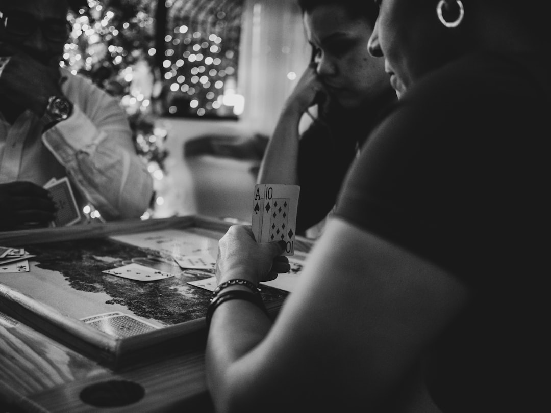 Family conversation card game deck arranged with road trip snacks on a picnic table.
