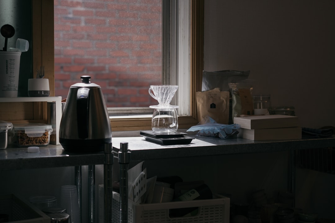 Compact counter with hot chocolate maker, cocoa ingredients, and ready mugs