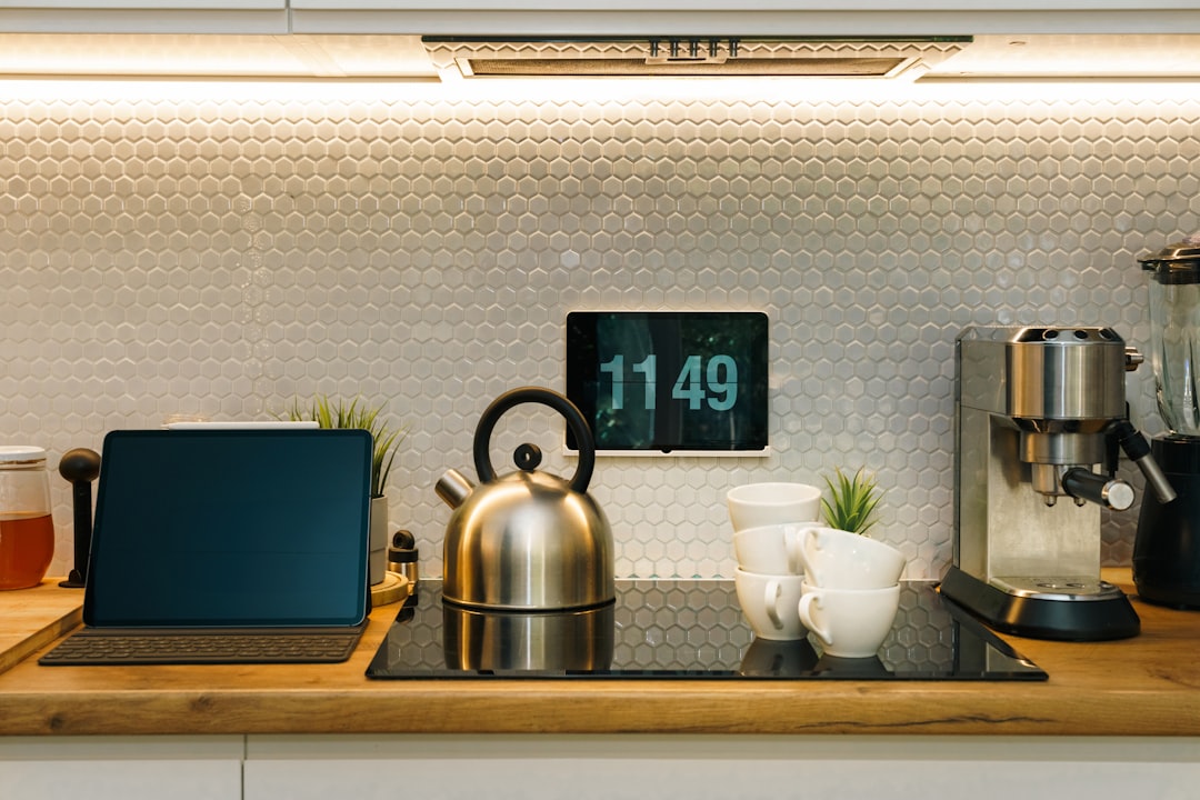 Compact countertop station with milk frother, temperature-control kettle, and two mugs ready for dairy and oat milk drinks