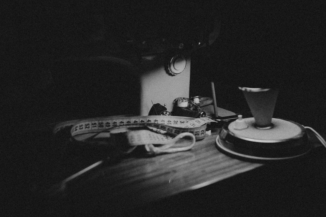 Small countertop drink station with kettle, milk frother, and cocoa mugs arranged for smooth service