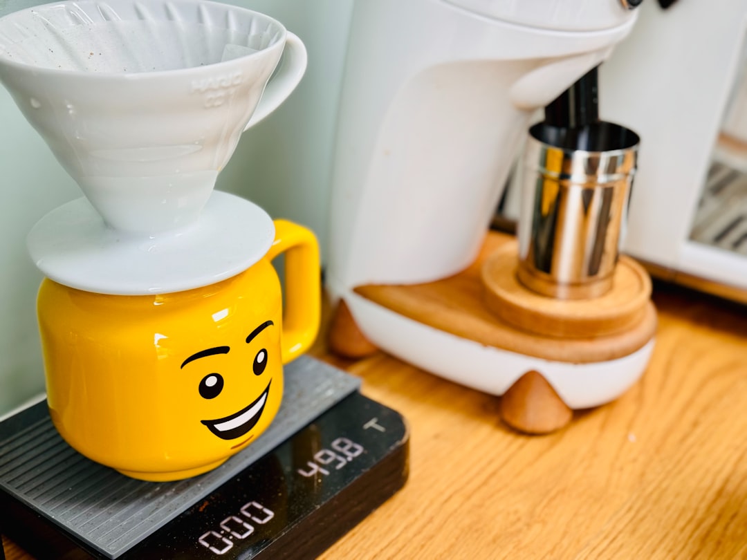 Compact countertop drink setup with kettle, milk frother, and hot chocolate gear