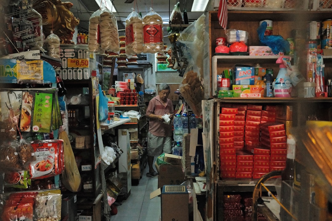 Small shop team checking a weekly operations checklist at the counter