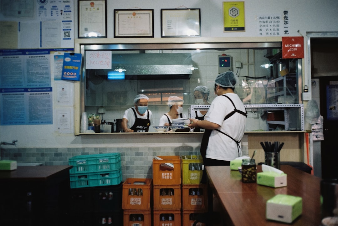Cashier and customer at a checkout counter managing a calm payment outage routine